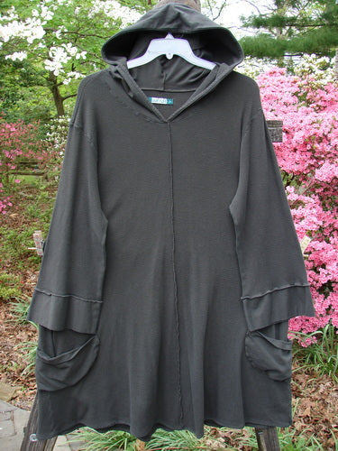 A vintage Barclay Thermal Cotton Lycra Hooded Circle Dress in Off Black, size 2, featuring a V neckline, cotton hood, cozy sleeves, circular pockets, A-line silhouette, and vertical seams. From BlueFishFinder.com's collection.