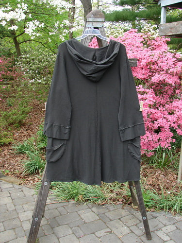 Vintage Barclay Thermal Cotton Lycra Hooded Circle Dress in Off Black, Size 2. A V-neck, cozy hood, circular pockets, A-line silhouette, and unique hemline. Bust 58, Waist 58, Hips 62, Sweep 90, Length 40-42.