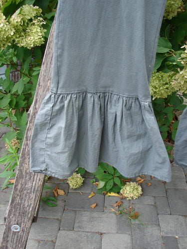 Barclay NWT Poplin Bottom Pantaloon Unpainted Chimera Size 0 features a gathered, ruffled hem draped over a rail, with a leafy garden and stone patio backdrop, embodying BlueFishFinder's vintage, expressive style.