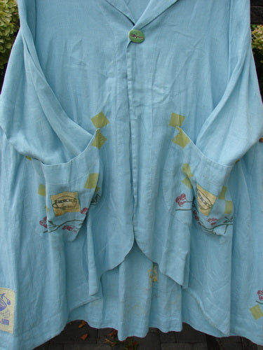 1999 Linen Breeze Jacket Tea & Cherries Spring OSFA: This lightweight, mid-thigh aqua jacket features a green button, oversized pockets with motifs, a sailor collar, and a flowing silhouette, epitomizing vintage Blue Fish creativity.