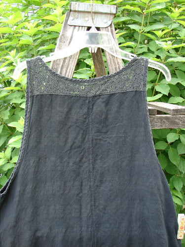 Barclay Linen Lace Two Pocket Pinafore Metallic Travel Black Size 0 showcases a front rounded neckline, deeper arm openings, and a window lace back, highlighted on a garden swing, embodying Bluefishfinder.com's vintage charm.