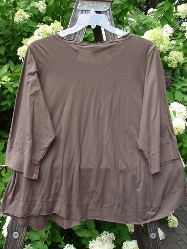 Brown Barclay Angle Flutter Bottom Top in Deep Sand, NWT. Light organic cotton with rounded neckline and angled hemline. Wider flutter accent and raw cut hem. Three-quarter sleeves. Size 2, 54" bust, 54" waist, 56" hips, 25-26" length.
