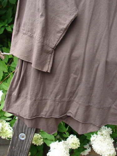 Barclay NWT Angle Flutter Bottom Top in Deep Sand, a close-up of a dress with a small flutter neckline, angled hemline, and raw cut hem. Size 2.