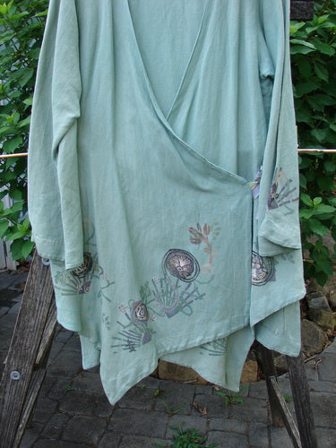 Barclay Viscose Long Ribbon Side Tie Jacket Garden Folly Kelp Size 0 features a frayed silk ribbon closure, painted hemline, and yoke seam, highlighting its unique, flowing design.