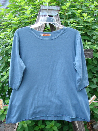 Barclay Slub Three Quarter Sleeved Cafe Tee Unpainted Tealen Size 1 on a swinger, showcasing its lightweight organic cotton texture, rounded neckline, straight shape with slight flare, and distinctive curly edgings.