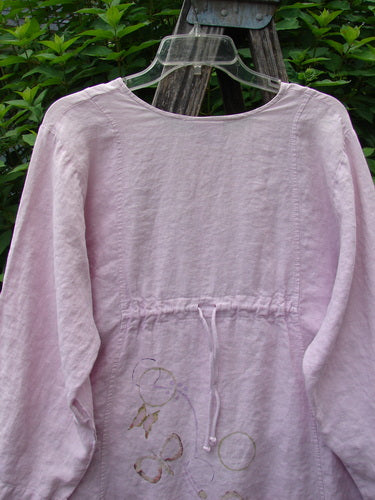 Barclay Linen Shell Button Drawcord Cardigan Butterfly Orchid Size 0 showcases a flowy, medium-weight linen design with sectional vertical curved panels, shell buttons, and a butterfly garden theme, emphasizing creativity and individuality.