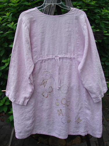 Barclay Linen Shell Button Drawcord Cardigan Butterfly Orchid Size 0, showcasing shell buttons, a drawcord backline, and butterfly garden paint, with a flowy hemline and slightly rounded neckline.