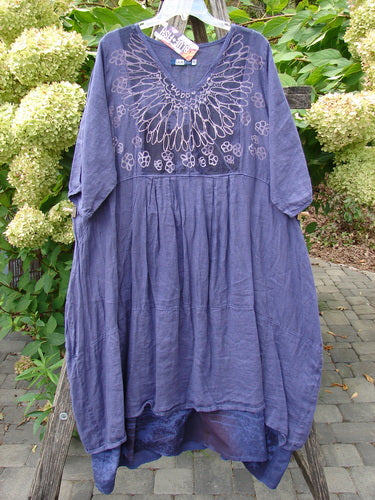 Barclay NWT Linen Process Two Story Dress Mum Ultra Violet Size 0, featuring a loose fit, three-quarter sleeves, gathered waist, and floral embroidery on bodice, displayed outdoors on a hanger.