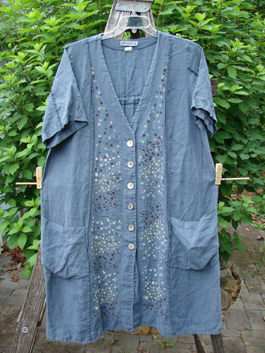Barclay Linen Double Tie Back Jacket Star Rain Blue Mineral Size 0, showcasing its deep V-neckline, short sleeves, A-line sweep, and vertical stitchery, emphasizing its creative and vintage-inspired design.