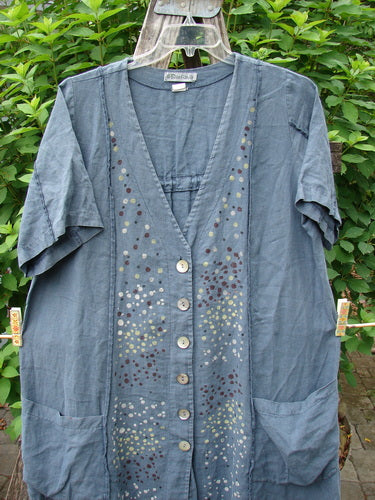 Barclay Linen Double Tie Back Jacket Star Rain Blue Mineral Size 0, showcasing a unique A-line sweep and exterior vertical stitchery, featuring a deep V-neckline and short sleeves, perfect for expressing individual style.