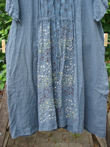 Barclay Linen Double Tie Back Jacket Star Rain Blue Mineral Size 0, showcasing a deep V neckline, A-line sweep, vertical stitchery, front pockets, varying hemline, and upper rear shoulder drawstring.