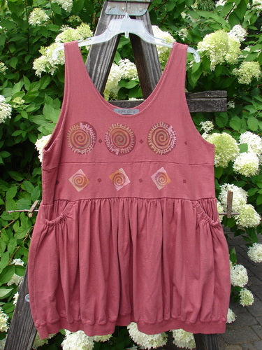 1996 Amusement Jumper with circle track theme, made of pink dress with spirals, size 1.