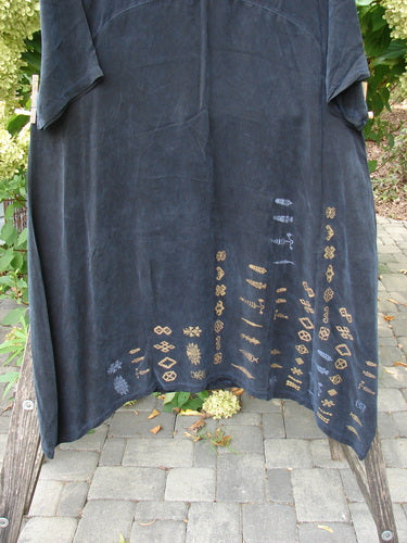 Barclay NWT Cupro Cross Over Urchin Dress features a loose, flared cut with an asymmetrical hem, adorned with metallic geometric motifs, capturing BlueFishFinder's unique, expressive style. Ideal for evening wear.