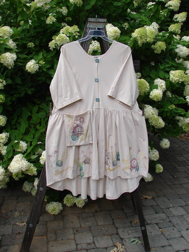 Barclay Flower Garden Cardigan Dress, size 2, with a white floral design on a dress rack.