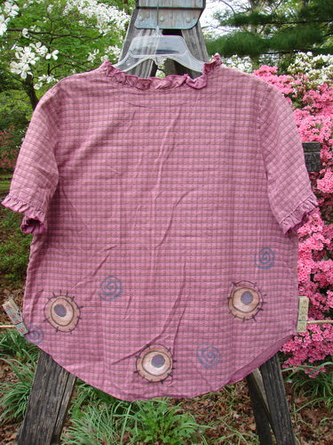 A vintage 1996 Woven Boardwalk Top with a whimsical unpainted hibiscus gingham pattern, featuring gathered ruffle neck and sleeves, rounded hem, and retro fish design. From BlueFishFinder's collection of unique, expressive clothing.