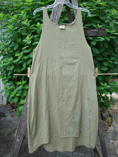 Barclay Batiste Slip Dress Floral Reach Seed Size 0 on clothesline, featuring a rounded neckline, empire waist, and floral pattern, perfectly capturing the vintage aesthetic of Bluefishfinder.com.