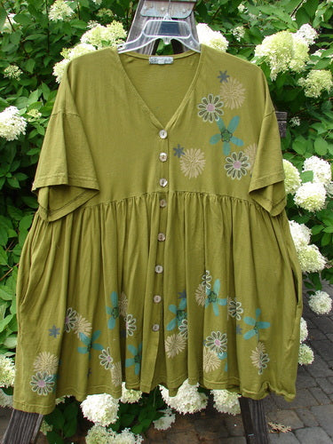 Barclay Tree Top Cardigan Dress with floral blossom pattern on light green fabric.