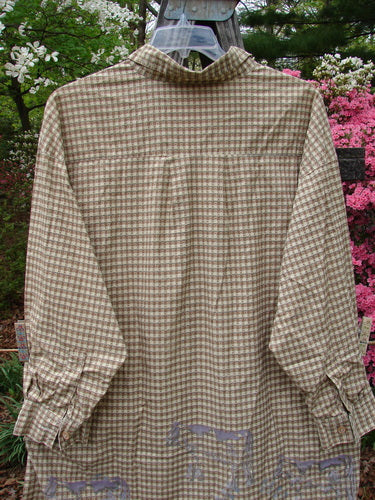 Vintage 1996 Woven Tourist Top featuring a Farm Cow design in White Pine Gingham on a mannequin. Details include wooden buttons, rolled cuffs, and a stand-up collar. From BlueFishFinder's collection of unique, expressive vintage clothing.