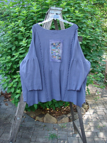 The Barclay Patched Thermal Curl Pocket Cardigan Geos Royal Orchid Size 3 displays patchwork design with dolman sleeves, button front, and exterior pockets, reflecting the creative freedom of Bluefishfinder.com.