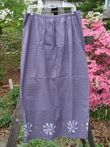 Vintage 1996 Woven Clambake Skirt in Wind Pinwheel Niagara Gingham, Size 2, from BlueFishFinder. Features front tie waist, elastic back, walking vent, and hip measurements. Perfect for creative expression.