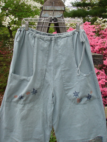 Vintage 1993 Garden Pant featuring a leaf and tree theme in Ocean. Medium weight cotton, crop wide shape, corded side ties, deep pockets. Perfect for creative expression. From BlueFishFinder's curated collection.