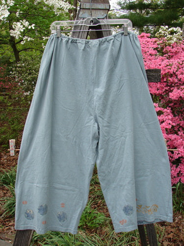 A vintage 1993 Garden Pant from BlueFishFinder.com: Ocean-hued, size 2. Medium weight cotton, corded side ties, wide crop shape, leaf and tree paint motif. Waist 26-58, Hips 58, Inseam 21, Length 35.