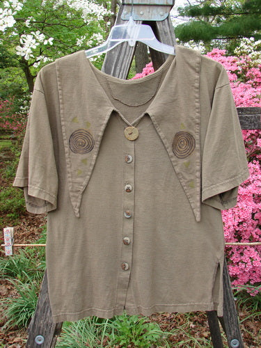 Vintage 1994 Compass Top Wind Garden Bark Size 1, a brown shirt with circles on a clothes rack. Features a big pointed over collar, original BF buttons, ceramic top button, and wind garden mixed theme paint.