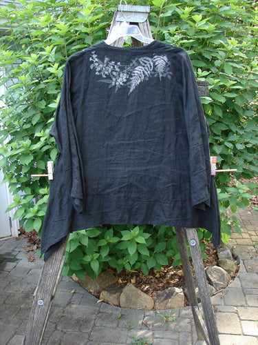 Barclay Linen Tiny Button Dip Side Cardigan Fern Shadow Black Size 0 displayed on a wooden stand, highlighting its deep V-neckline, three-quarter sleeves, and shell button closures, embodying Bluefishfinder.com's vintage style.