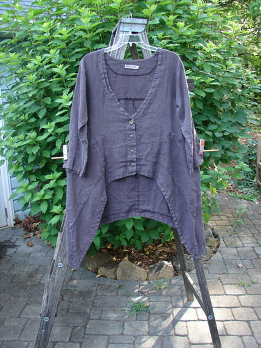 Barclay Hemp Cotton Summercloth Dip Side Pocket Jacket Pinwheel Brum Size 1 displayed on a clothes rack, showcasing its V-shaped neckline, three-quarter sleeves, dual angular pockets, and pinwheel paint detail.