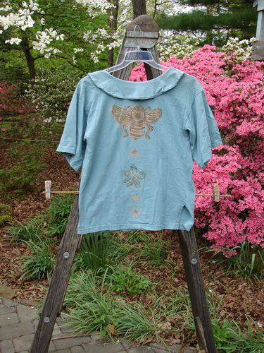 Vintage 1994 Compass Top featuring Garden Bee design in Dusk, size 1. Detailed with BF buttons, pointed collar, and sweet side vents. Perfect condition. Measurements: Bust 42, Waist 44, Hips 44, Length 26.
