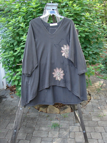 1998 Botanicals Bell Flower Top CXLVIII Raven Size 2 displayed on a wooden ladder, showcasing its unique floral pattern, belled A-line shape, and softly rounded neckline for vintage-inspired elegance.
