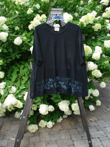 2000 T Top Floating Florals Black Size 2: Swing top with huge A-line shape. Continuous florals and side vents. Made from heavy weight linen. Bust 54, Waist 58, Hips 62, Sweep 80, Length 30.