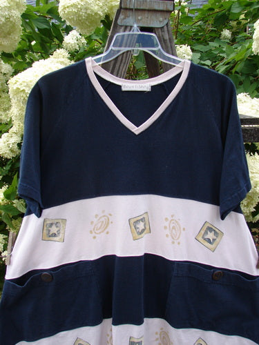 Image alt text: "1998 Cricket Top Star Game Crew Blue Size 2: A blue and white shirt with a wide A-line shape, vented hemline, and front lower exterior pockets accented by numeral taganut buttons. Features a V-shaped and ribbed neckline, classic star games theme paint, and a Blue Fish Games patch."