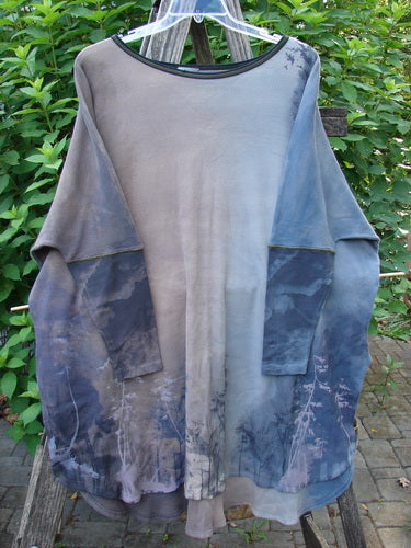 Barclay NWT Thermal Contrast Revival Top Tunic Tree Line Amethyst Smoke OSFA features ribbed sleeves, rounded neckline, and unique tree line pattern, displayed on a clothes hanger, highlighting its detailed fabric design.