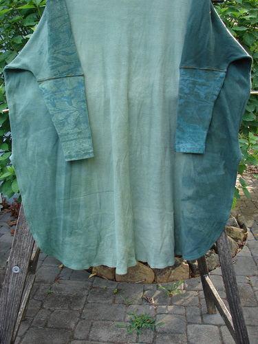 Barclay Thermal Contrast Revival Top, Botanicals Green Storm OSFA, showcases ribbed accents and a rounded neckline. The close-up highlights its unique tapering sleeves and botanical patterns, embodying BlueFishFinder's vintage charm.