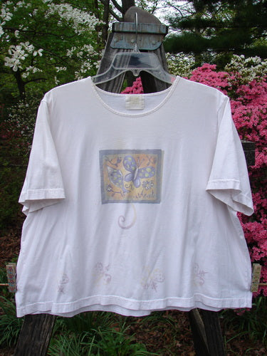 1999 Light Weight Short Sleeved Crop Tee Butterfly Orchid Size 2, featuring a butterfly motif on a white background with a rounded neckline and boxy shape, made from organic cotton jersey.