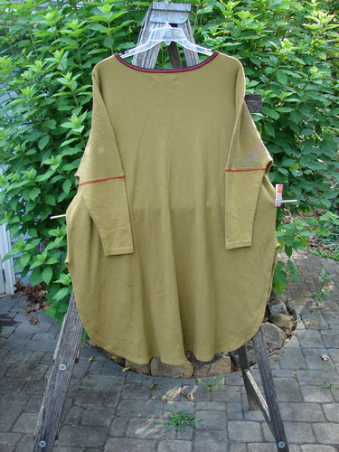 Barclay Thermal Contrast Revival Top Botanicals Yellow Olive OSFA displayed on a wooden stand, showcasing its ribbed sleeves, rounded neckline, and unique botanical theme, embodying BlueFishFinder's vintage-inspired aesthetic.