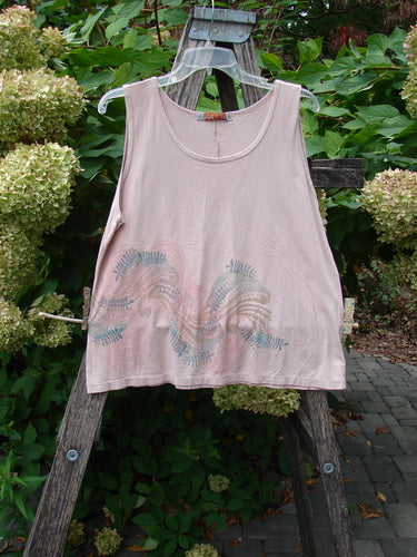 Barclay Batiste Tank Top Fern Wind Blush Size 1, featuring a whimsical foliage graphic, sleeveless design, and slightly deeper neckline, displayed on a hanger against a natural, garden setting.