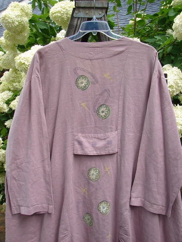 1999 Parlor Jacket with Circle Florals, Heliotrope, Size 2: Purple shirt with a design, long sleeves, V neckline, gathered front and back, side pockets, rear painted tab, sectional panels, widening shape, varying hemline.