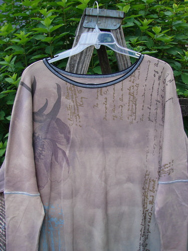 Barclay Thermal Contrast Revival Top Script Pastels OSFA displayed on a swinger, highlighting its ribbed sleeves and rounded neckline, with visible side vents and a unique script theme design.