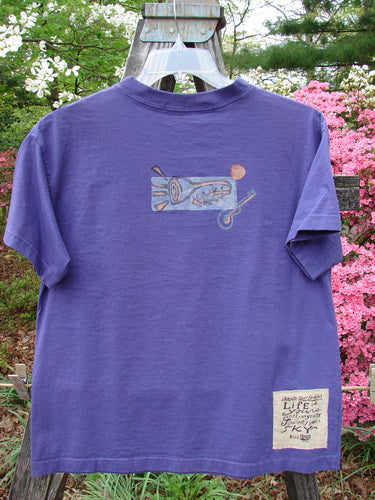 Vintage 1996 Short Sleeved Tee Drum Niagara Size 0 from BlueFishFinder.com: Purple tee with lizard drawing, ribbed neckline, drop shoulders, boxy shape, and music theme patch. Bust 44, Waist 44, Hips 44, Length 25.