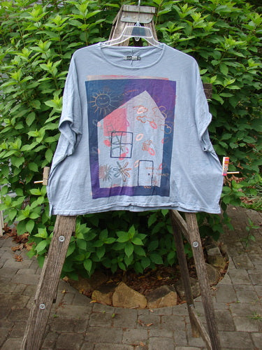 Barclay Cotton Slub Cricket Cap Sleeve Tee Sun Guy Dusty Blue OSFA features a house print, cool cap sleeves, rounded hemline, and seamless shoulder sleeve, embodying Bluefishfinder.com's vintage style and individuality.
