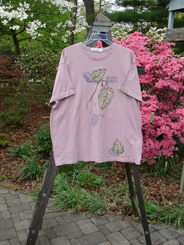 1998 Botanicals Short Sleeved Tee featuring Turn Leaf design from Passiflora Collection. Organic cotton tee with Blue Fish Patch, ribbed neckline. Bust 54, Waist 54, Hips 54, Length 32 inches.