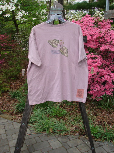1998 Botanicals Short Sleeved Tee featuring Turn Leaf Passiflora design, Size 2. Vintage Blue Fish Clothing in Perfect Condition. Organic Cotton tee with Blue Fish Patch and Ribbed Neckline. Bust 54, Waist 54, Hips 54, Length 32 inches.