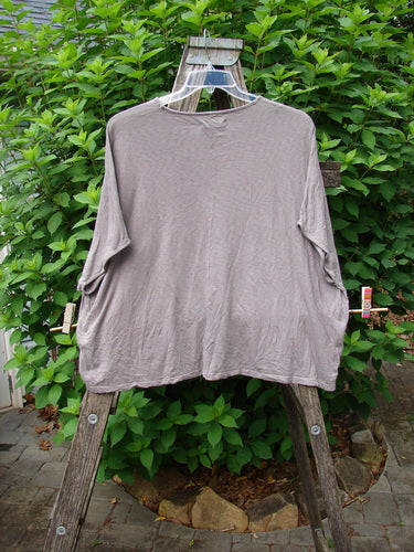 Barclay Cotton Slub Cricket Cap Sleeve Tee Leaf Play Light Stone OSFA displayed on a swinger, showcasing its seamless shoulder sleeves and rounded hemline, embodying the BlueFishFinder's vintage and creative clothing ethos.