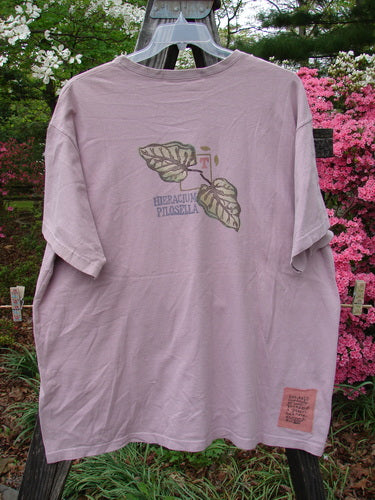 1998 Botanicals Short Sleeved Tee featuring Turn Leaf Passiflora design. Organic cotton tee with longer boxy shape, Blue Fish patch, and softly ribbed neckline. Bust 54, Waist 54, Hips 54, Length 32 inches.