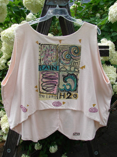 Image: A shirt with a graphic design on it, hanging on a plastic swinger with a handle. 

Alt text: 1992 Folk Vest Elements Tea Dye OSFA - Shirt with unique graphic design on swinger.