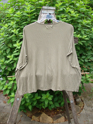 Barclay Cotton Slub Cricket Cap Sleeve Tee Forest Flock Bottlecap OSFA displayed on a clothes rack, highlighting its cap sleeves, seamless shoulders, and square boxy shape, embodying BlueFishFinder's unique vintage style.