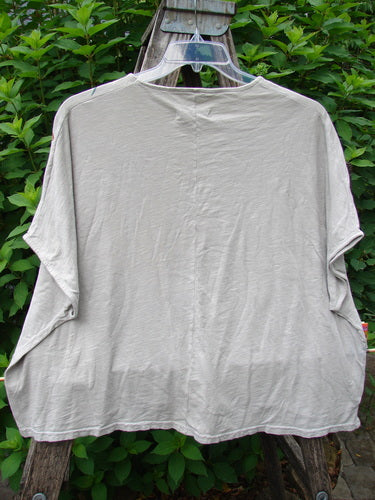 Barclay Cotton Slub Cricket Cap Sleeve Tee Butterfly Flax OSFA displayed on a swinger, showcasing its cap sleeves, seamless shoulders, rounded hemline, and butterfly garden theme, embodying BlueFishFinder's vintage creative style.