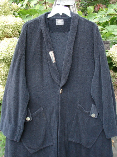 1999 Patched Chenille Angle Pocket Jacket Holiday Black Size 1 on hanger, showcasing oversized button closure, shawl collar, and diagonal oversized pockets with buttoned flaps, capturing the unique vintage BlueFishFinder style.